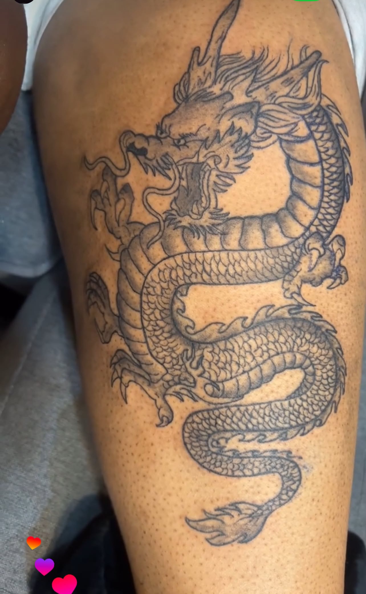 Black and grey dragon tattoo detail