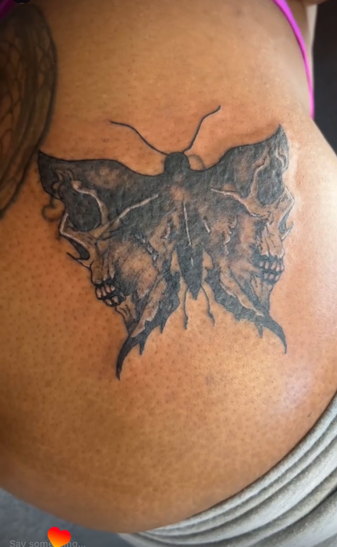 Moth and skull tattoo, second angle